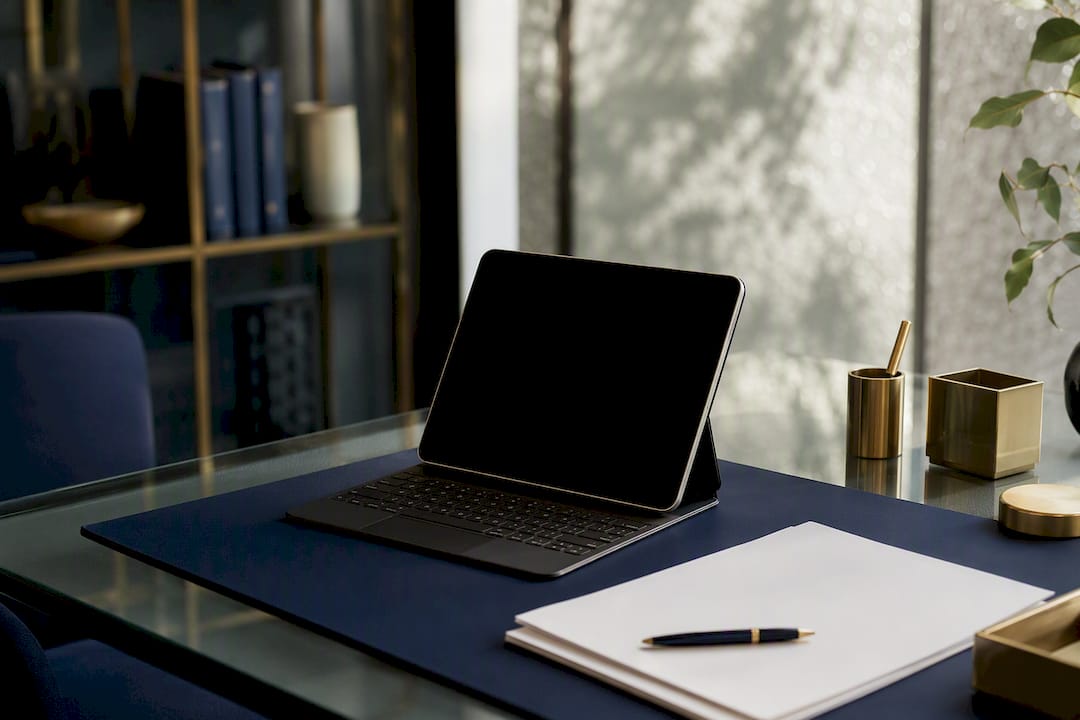Modern office desk with dark digital device screen